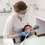 female-patient-having-procedure-done-dentist